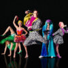 Colourful circus performers strike a pose