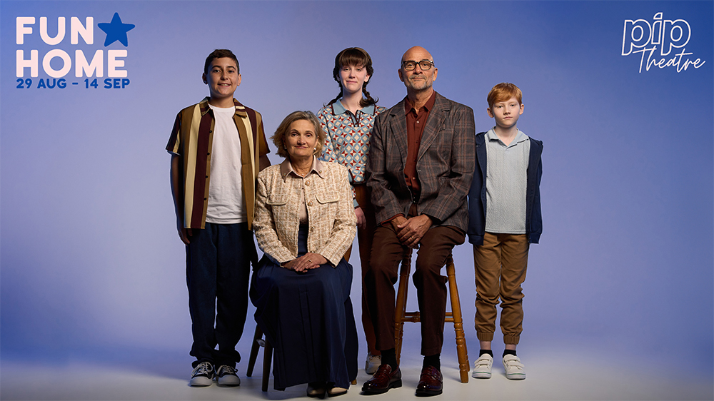 A mother and father pose with their three young children in the musical Fun Home