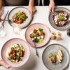 Five new dishes from Goldfinch Brisbane's winter menu sit on a white table