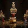 Cirque du Soleil Corteo features aerialists dangling from three giant swinging chandeliers.