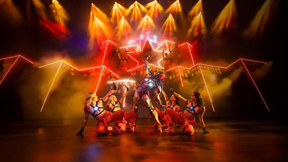 A group of women dressed as scantily clad Iron Men in Marvelous the risque parody